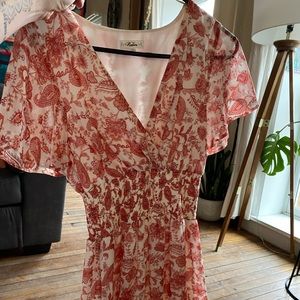 Bohemian high low dress. Peach and white floral pattern. Free people